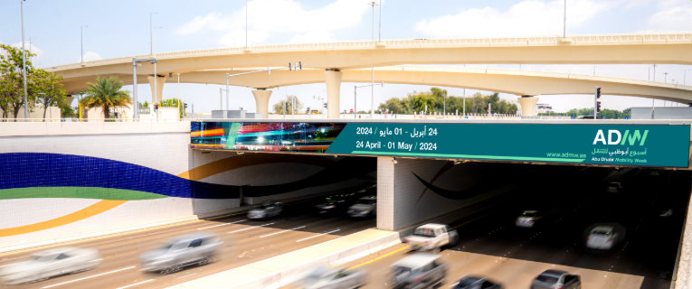 LED bridge banner spanning an Abu Dhabi underpass